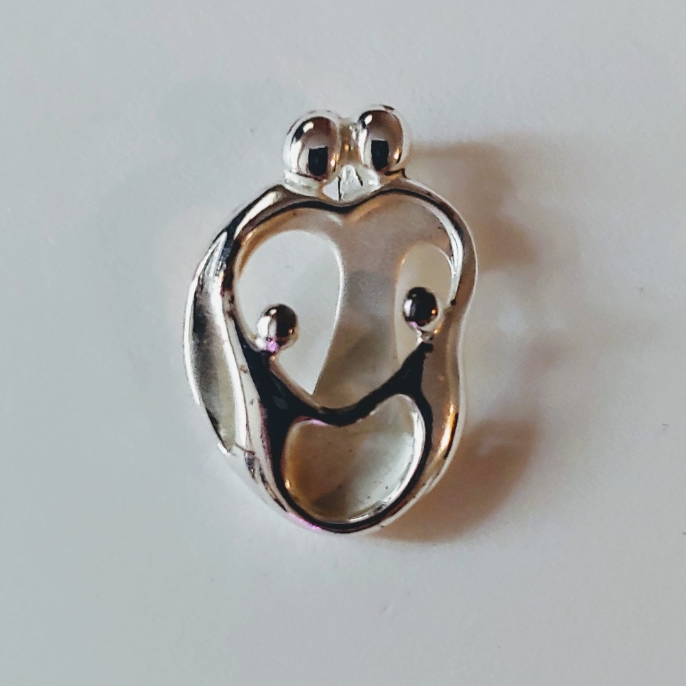 Parents w/two children pendant